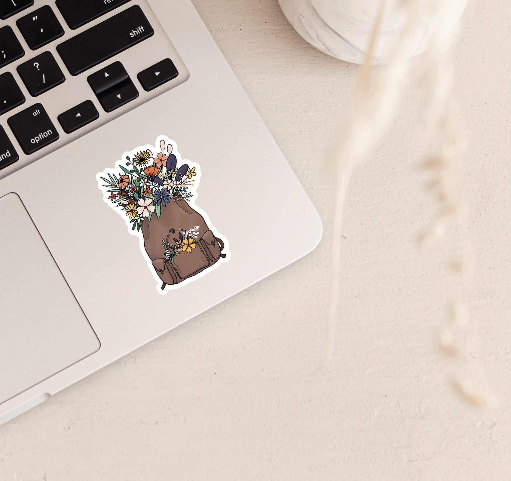 Backpack filled with flowers laptop sticker