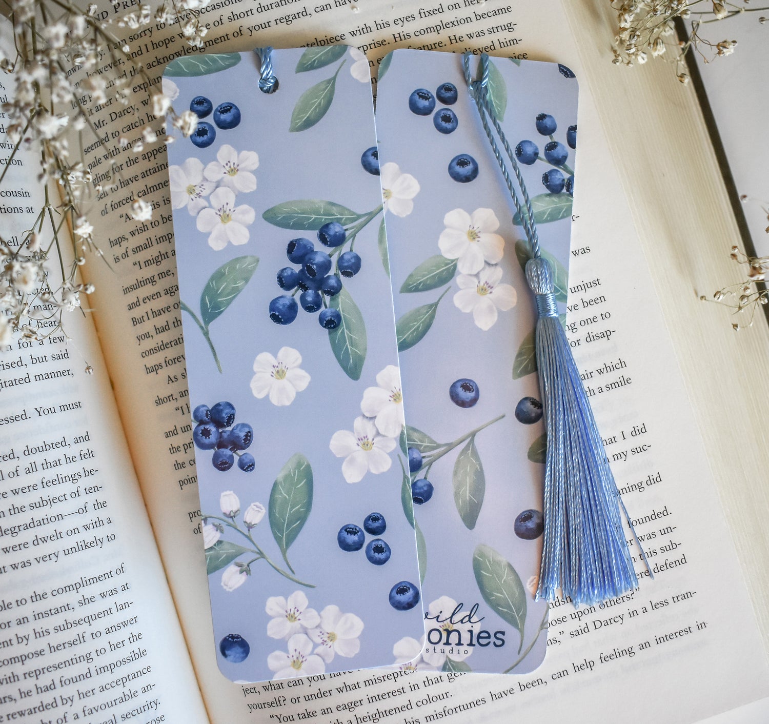 Bookmark with blueberry floral artwork design printed on both sides and a blue tassel