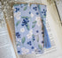 Bookmark with blueberry floral artwork design printed on both sides and a blue tassel