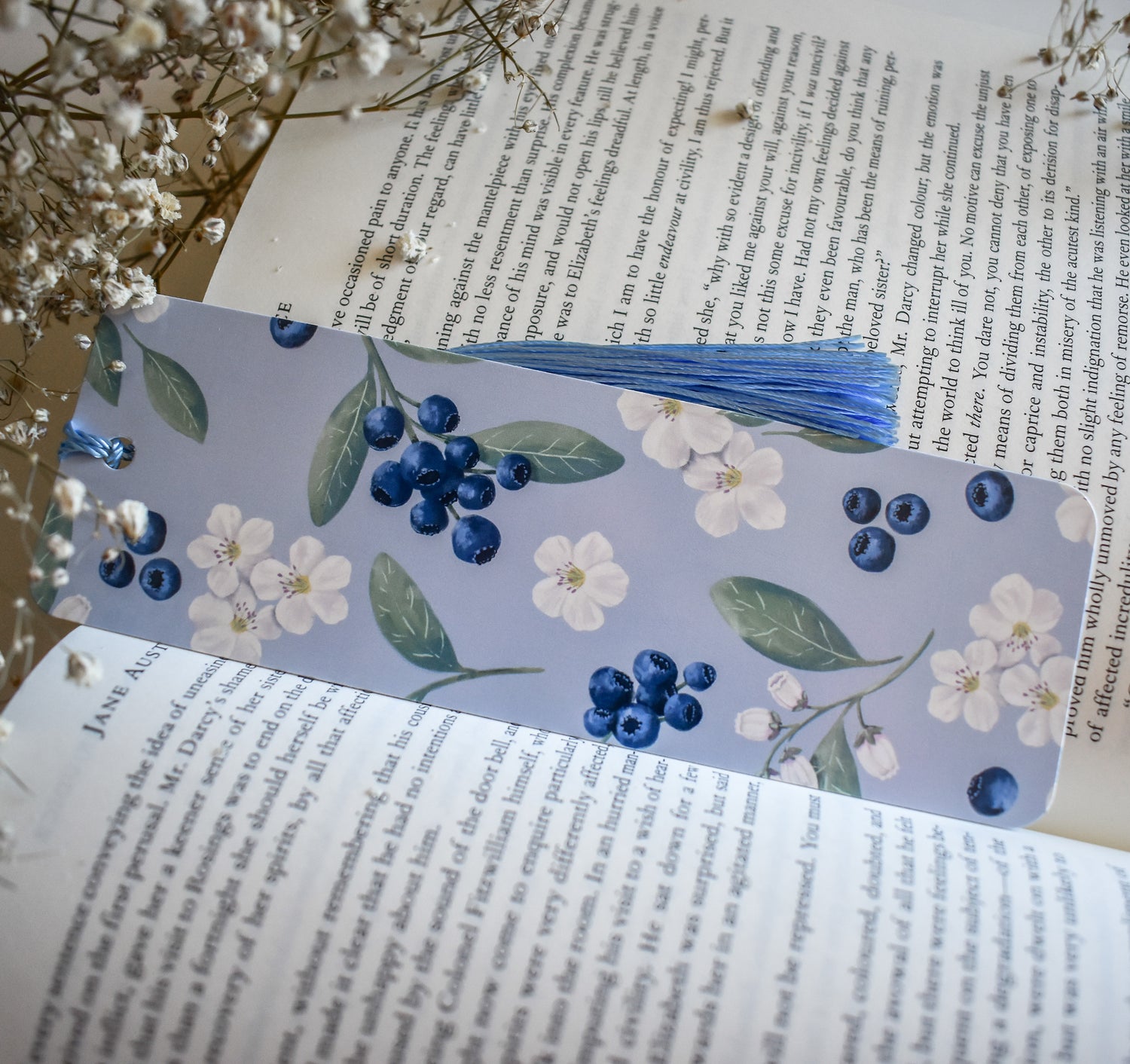 Bookmark with blueberry floral artwork design printed on both sides and a blue tassel
