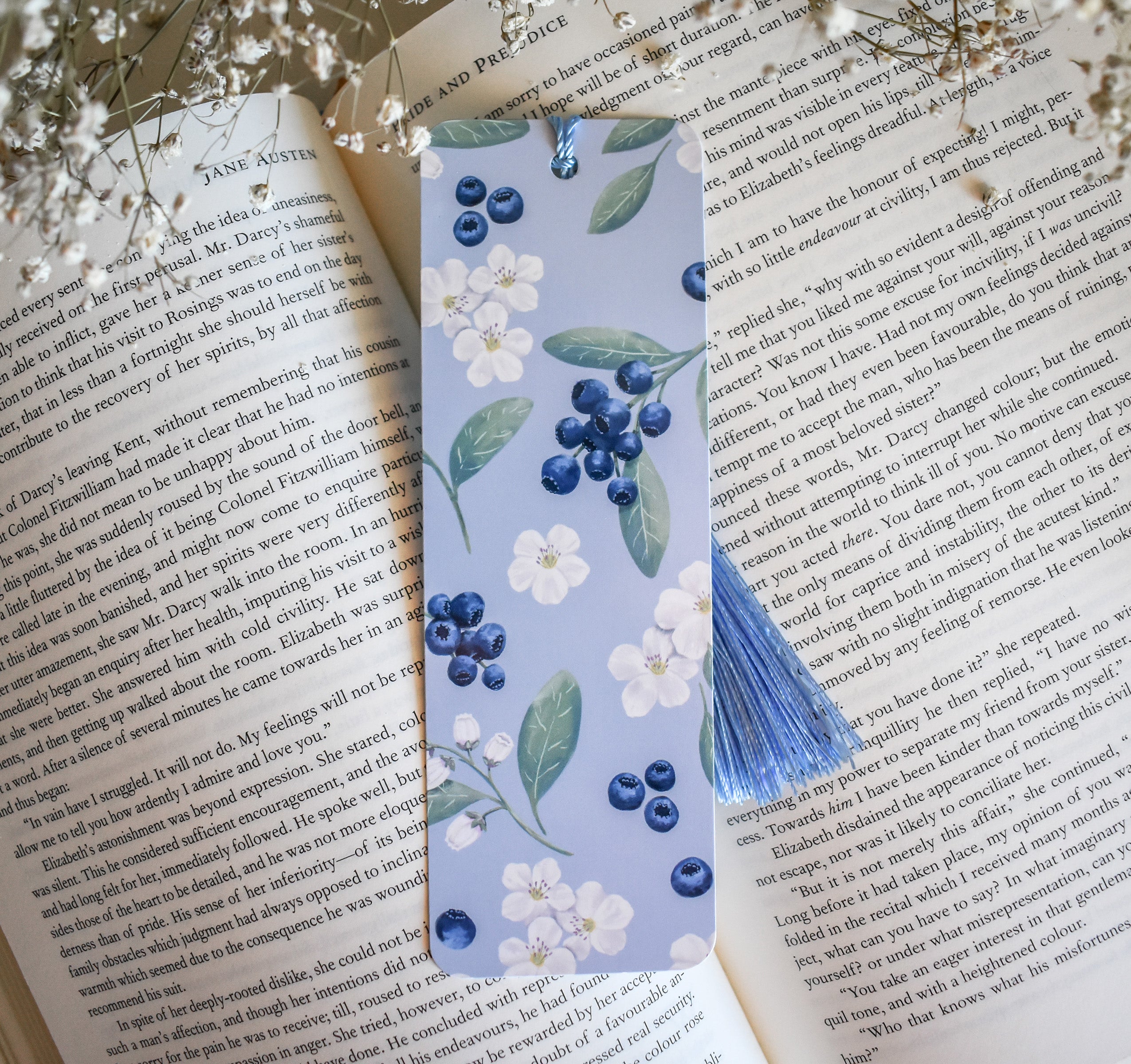 Bookmark with blueberry floral artwork design printed on both sides and a blue tassel