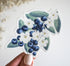 A bunch of blueberries with white flowers vinyl sticker