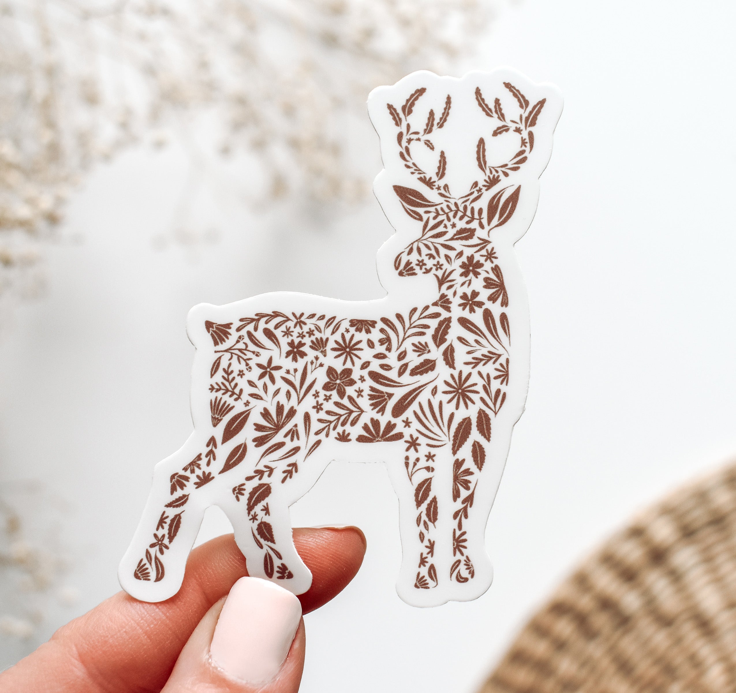 Decorative deer vinyl sticker with floral patterns