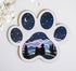 Man and his dog stargazing over the mountains refrigerator magnet in the shape of a dog paw print