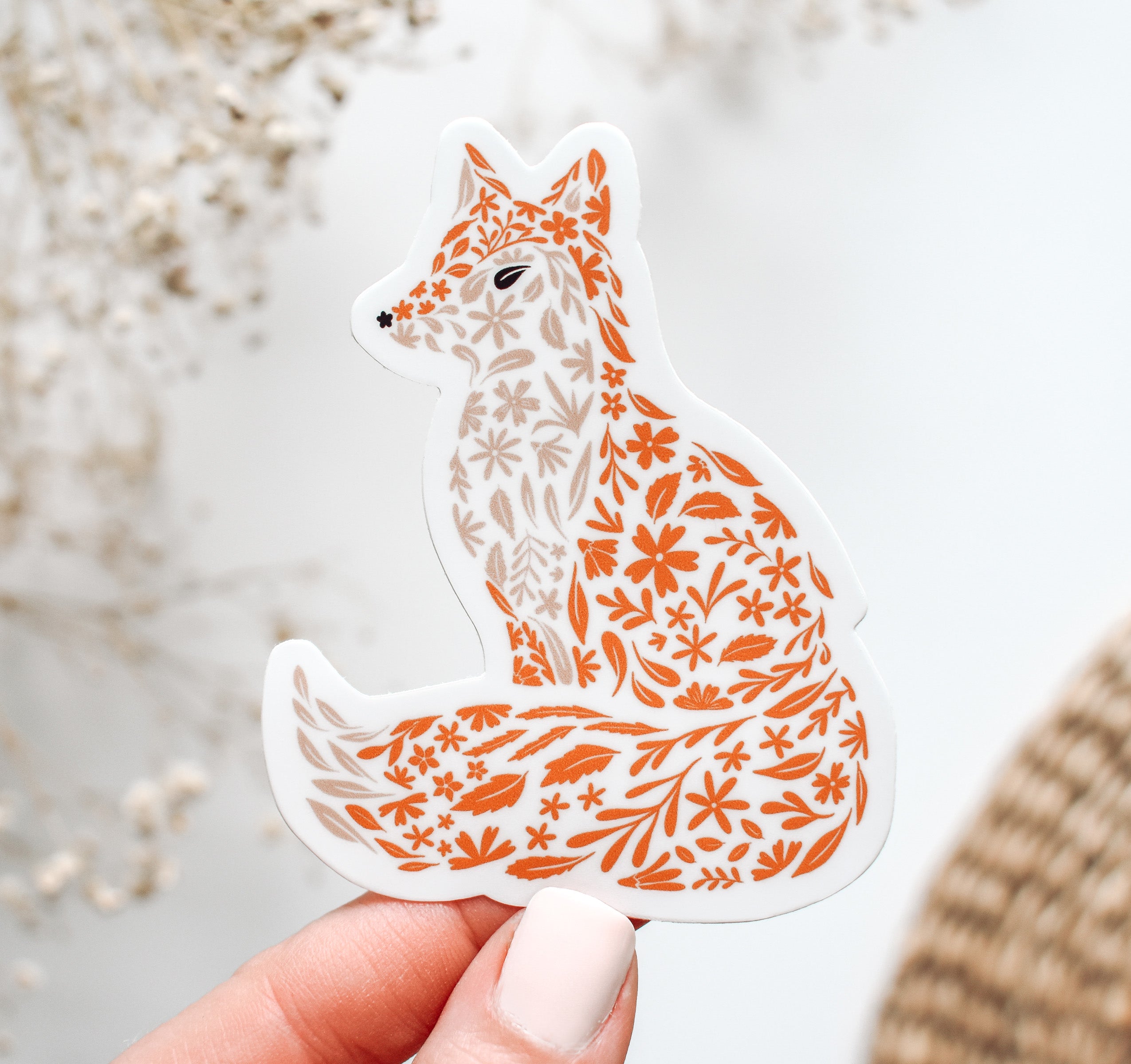 Decorative vinyl sticker of a fox with floral patterns