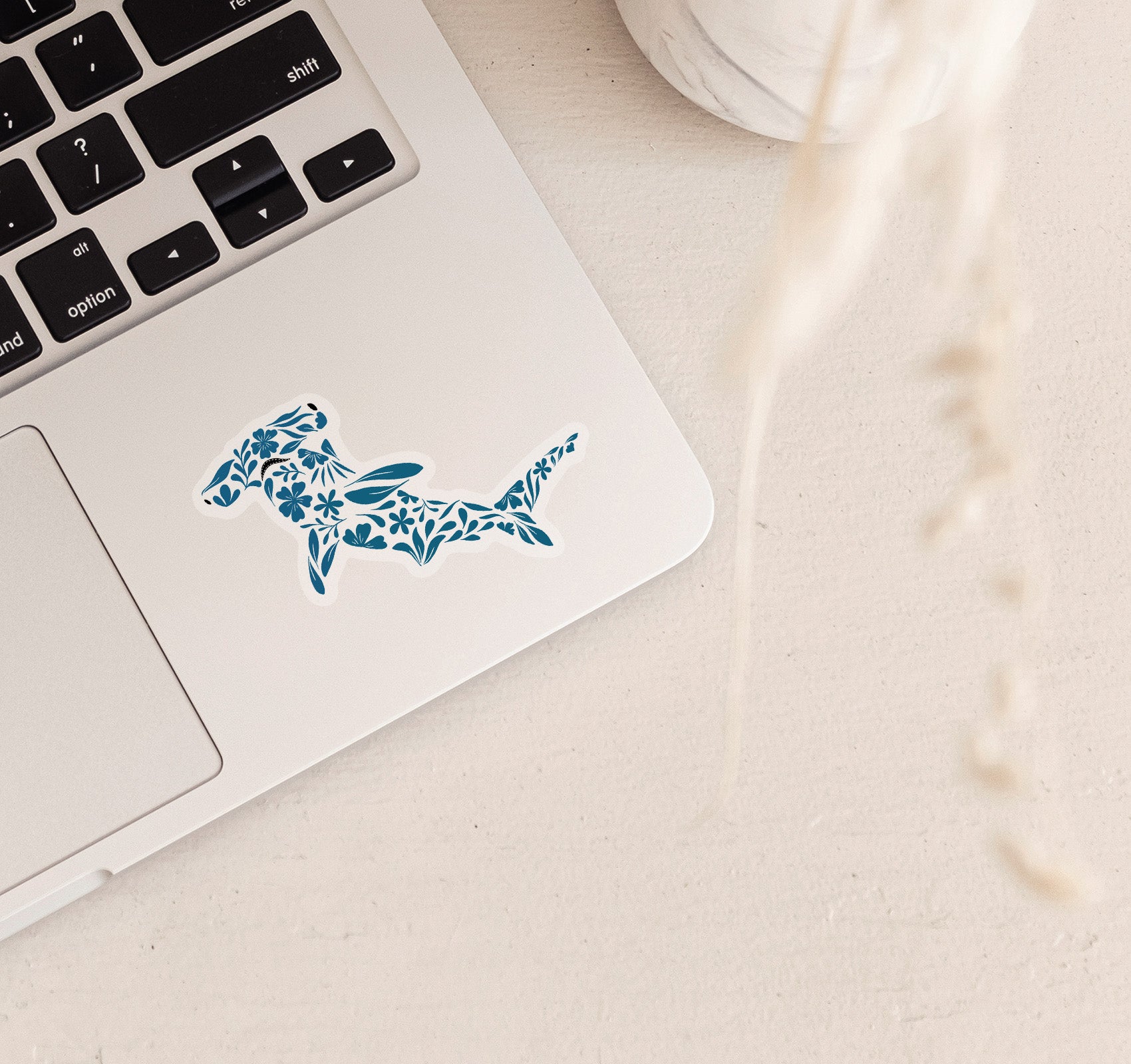Hammerhead shark laptop sticker created with turquoise flowers and leaves pattern
