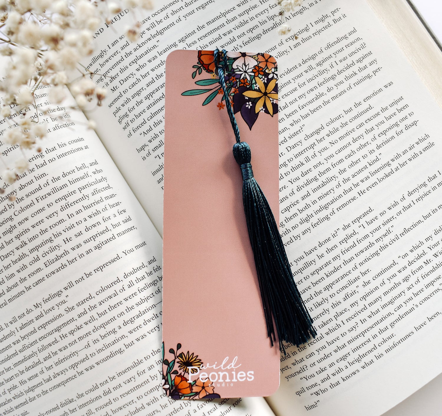 Bookmark with the John Muir quote "Of all the paths you take in life, make sure a few of them are dirt" and a hiking boot with flowers design