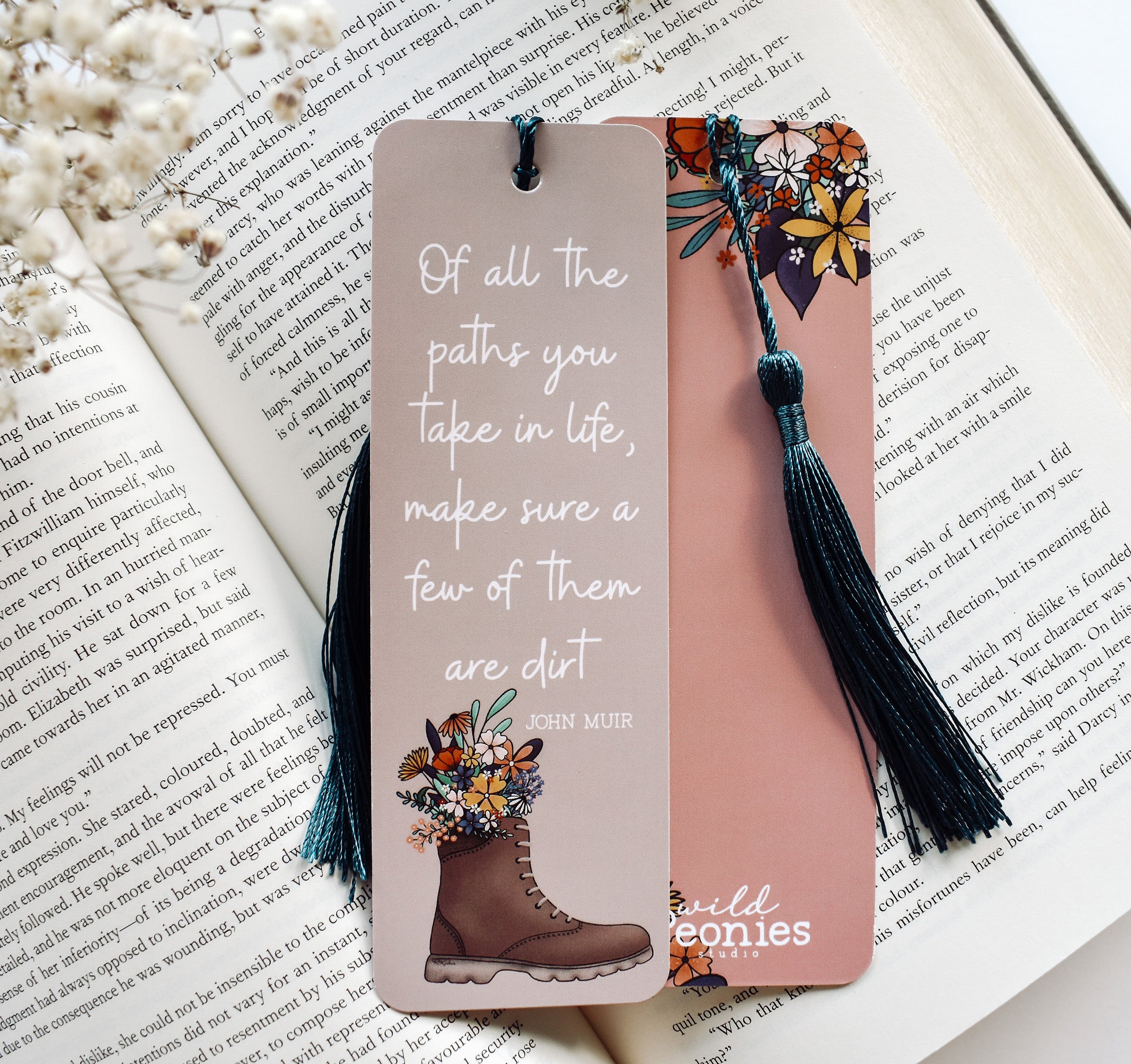 Bookmark with the John Muir quote "Of all the paths you take in life, make sure a few of them are dirt" and a hiking boot with flowers design