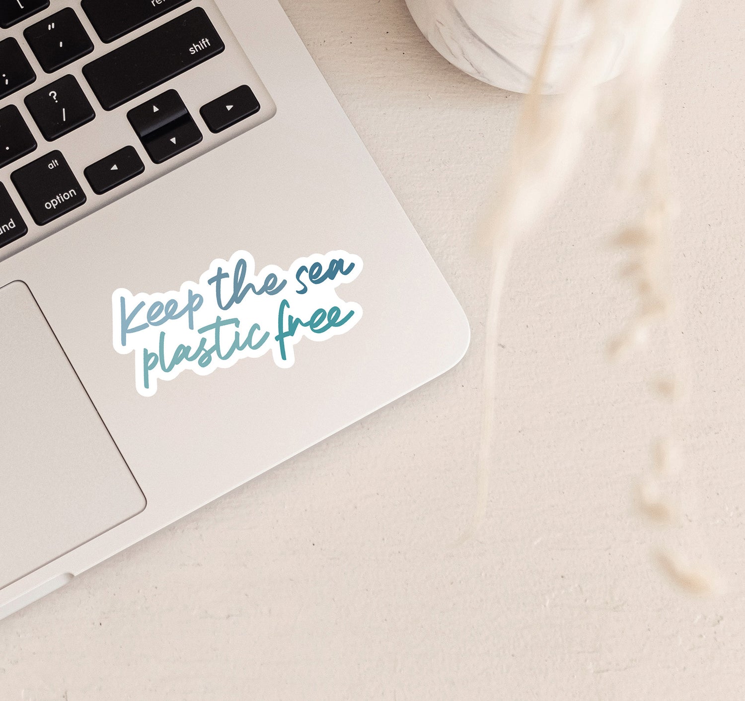 Keep the sea plastic free laptop sticker with ocean blue text