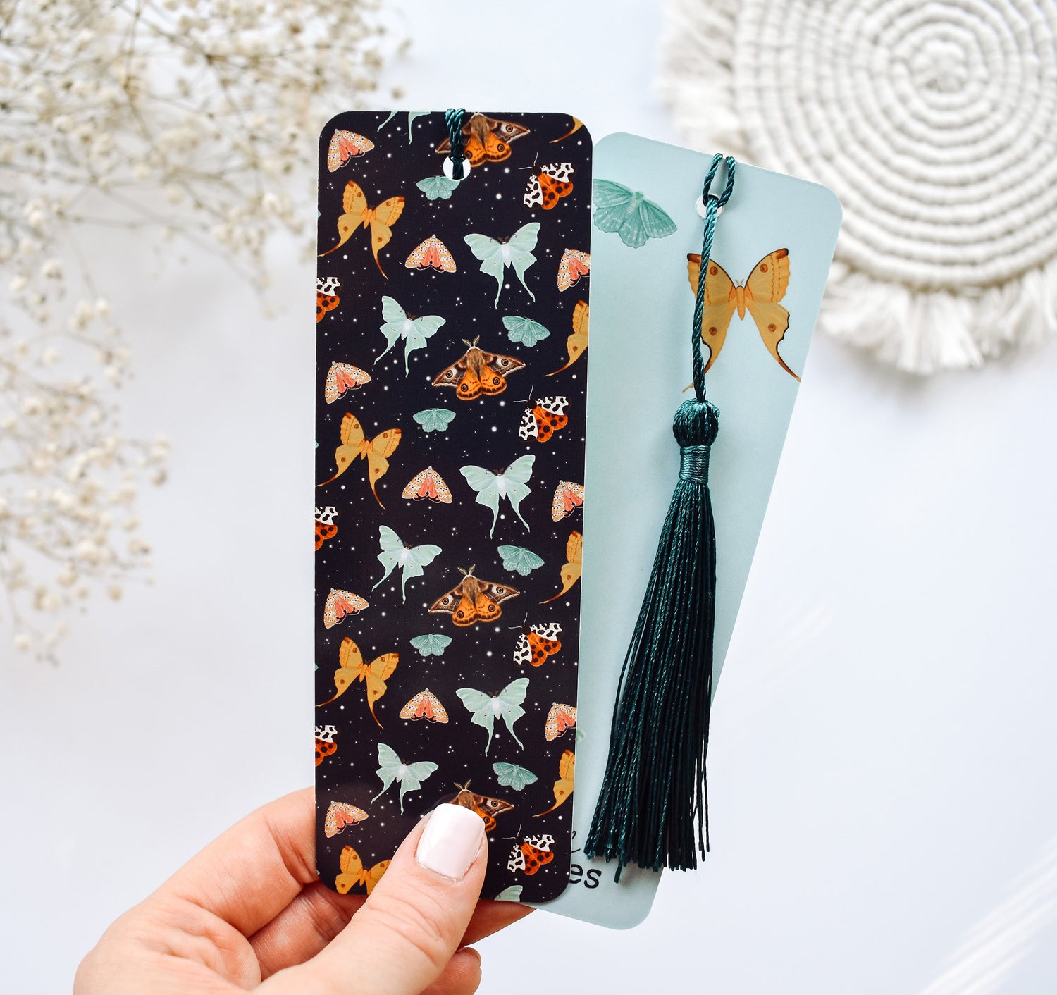 Bookmark with a pattern of moths, including the Emperor Moth, Luna Moth, Comet Moth, Emerald Moth, Bella Moth, and Garden Tiger Moth