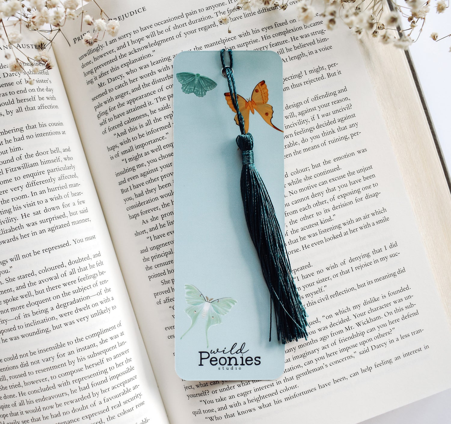 Bookmark with a pattern of moths, including the Emperor Moth, Luna Moth, Comet Moth, Emerald Moth, Bella Moth, and Garden Tiger Moth