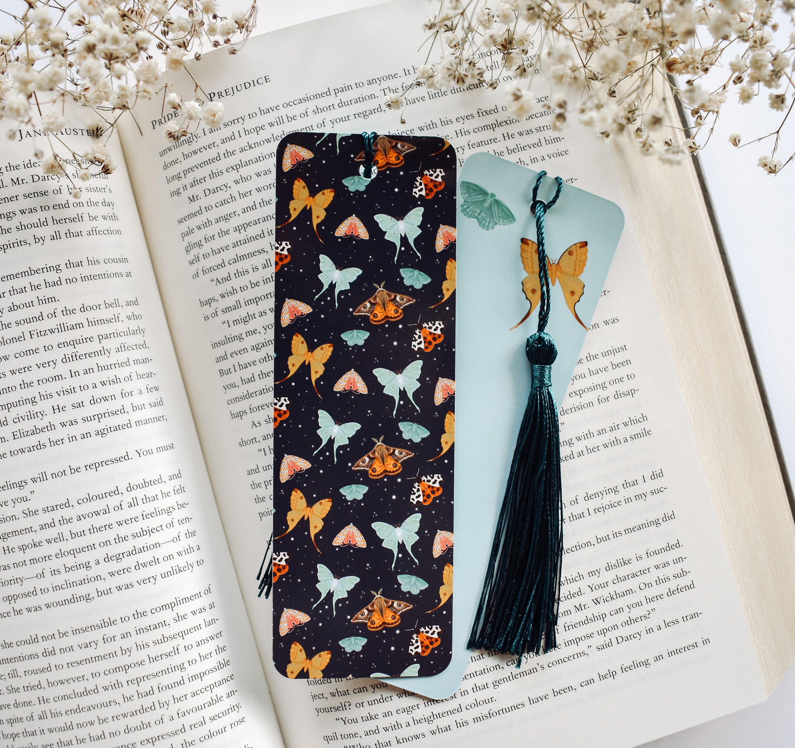Bookmark with a pattern of moths, including the Emperor Moth, Luna Moth, Comet Moth, Emerald Moth, Bella Moth, and Garden Tiger Moth