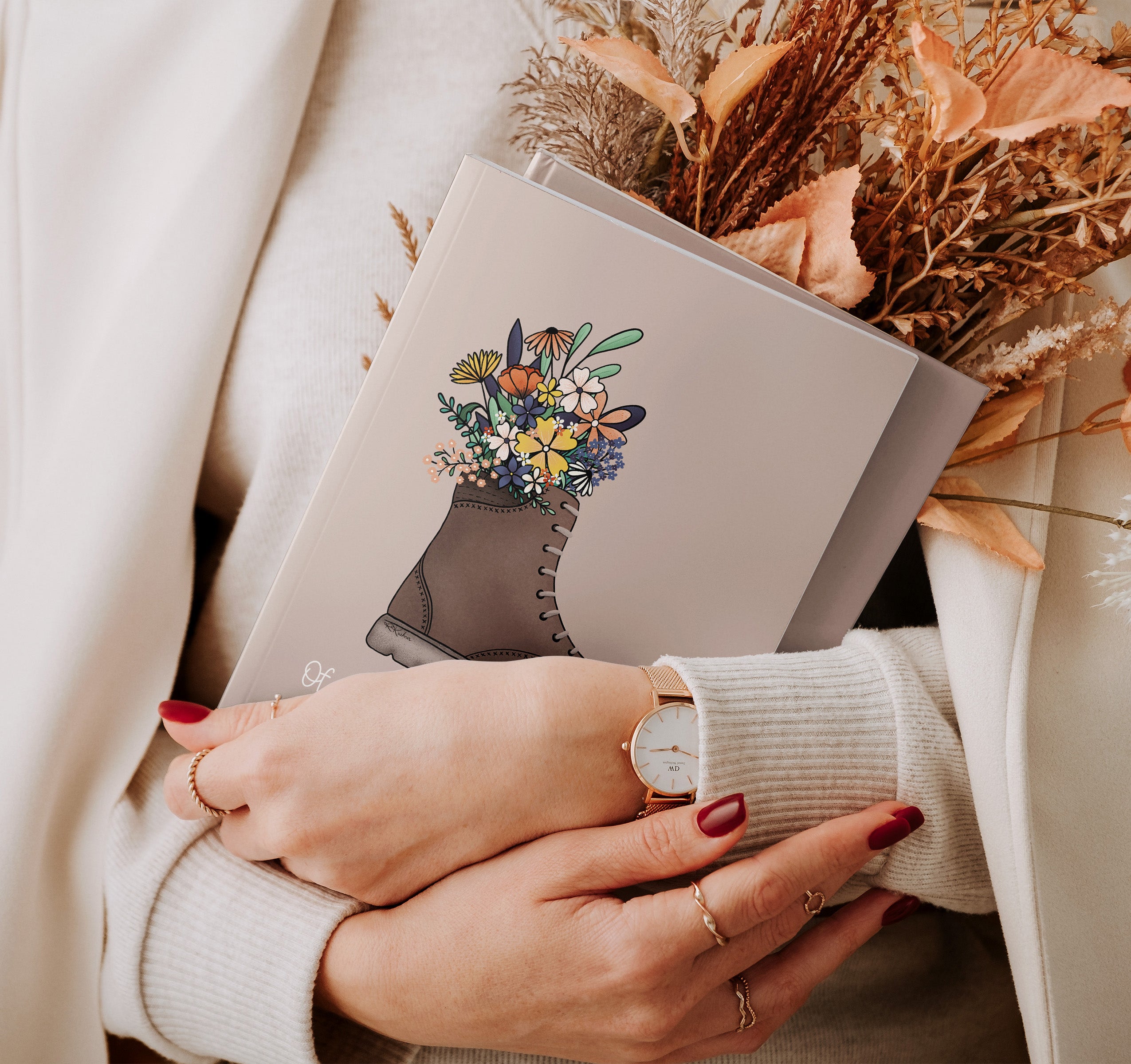 John Muir quote journal with a hiking boot full of flowers