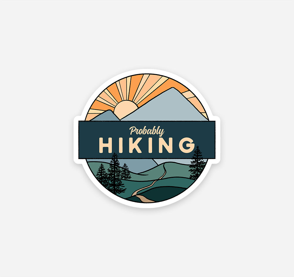 Mountain sticker with a trail, pine trees, and a sunset with the phrase "probably hiking"