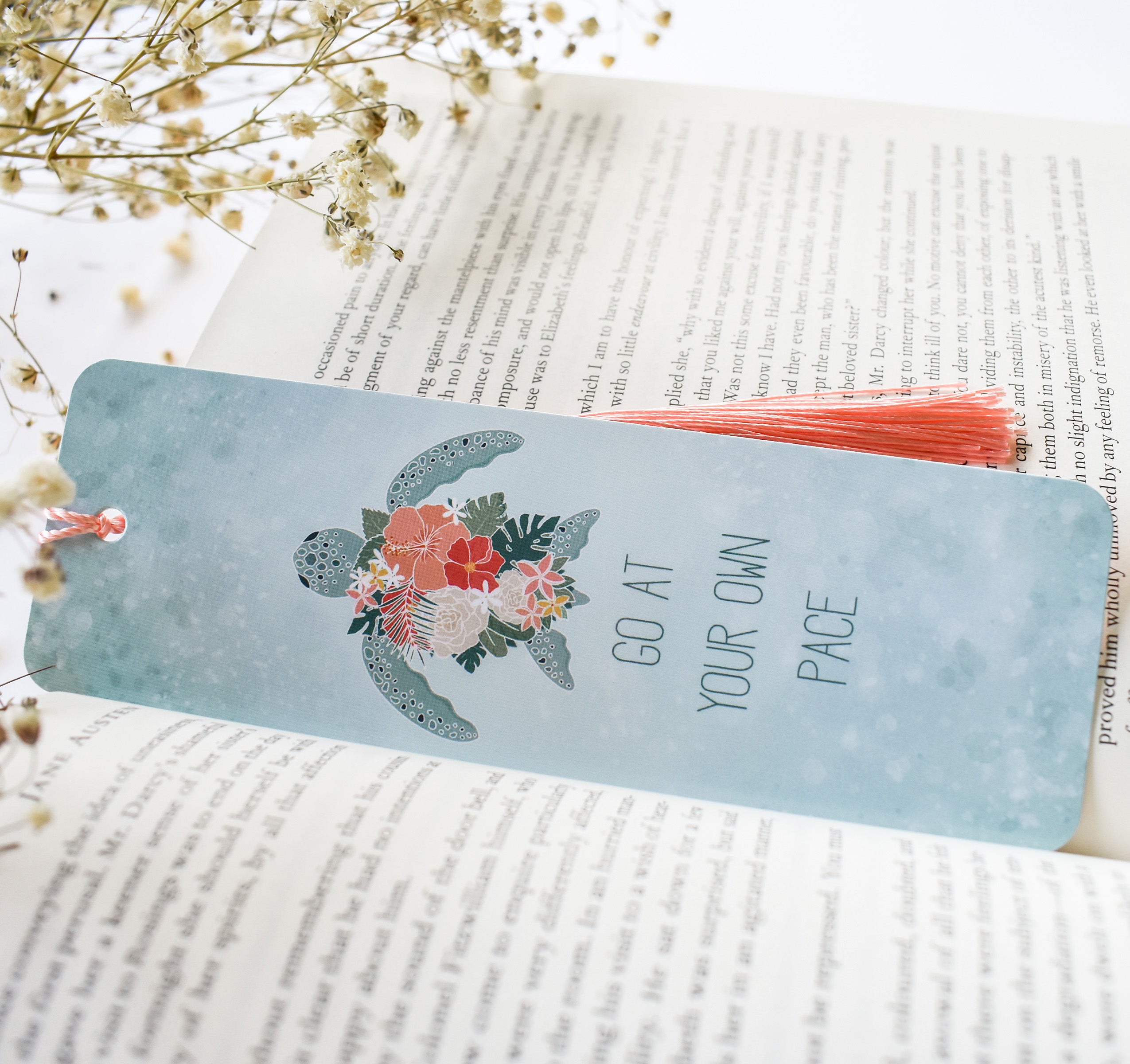 Hawaiian green sea turtle with tropical flowers bookmark and the quote "go at your own pace"