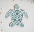 Decorative sea turtle magnet designed with pale teal flowers