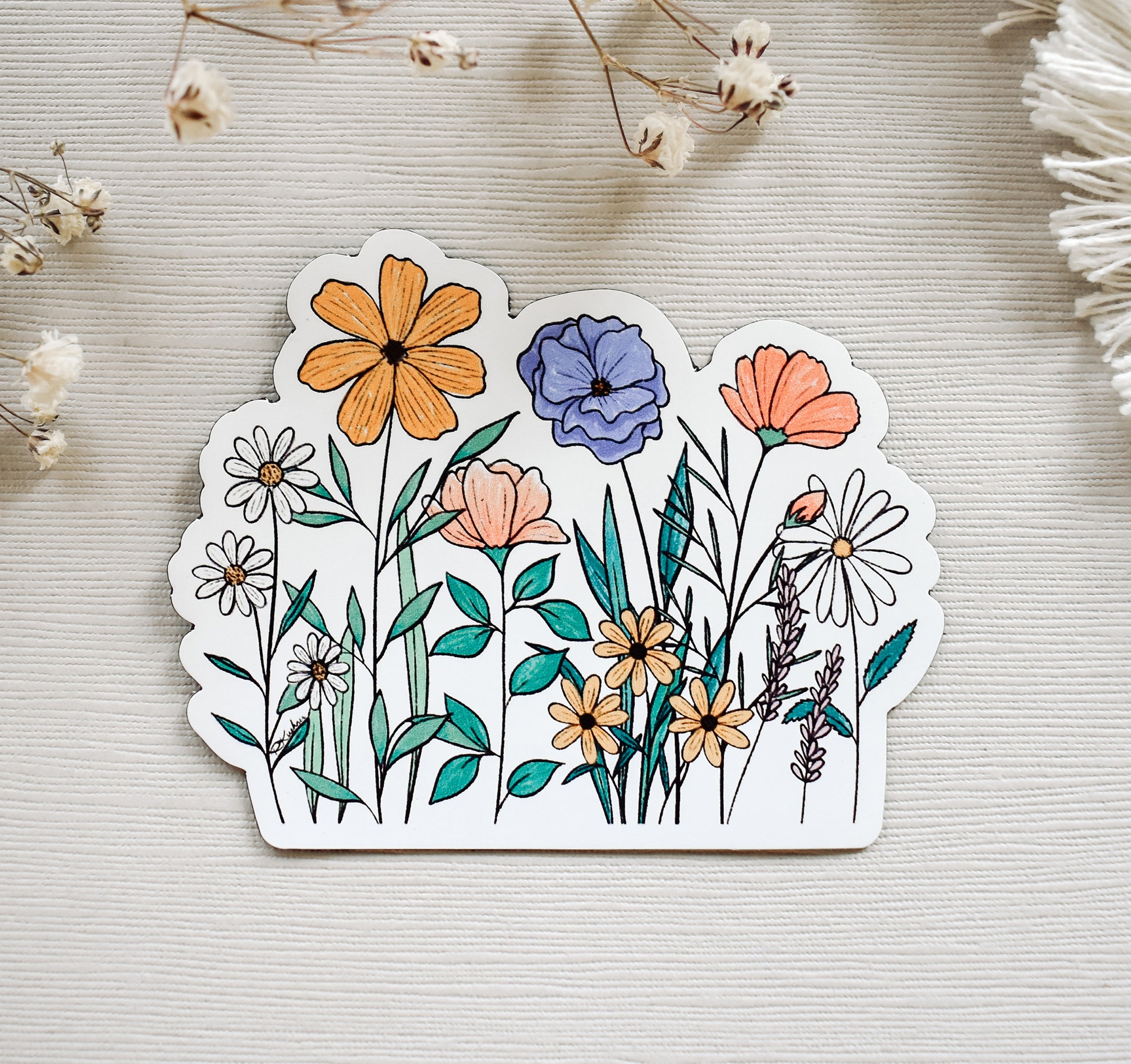 Beautiful and colorful wildflowers on a magnet