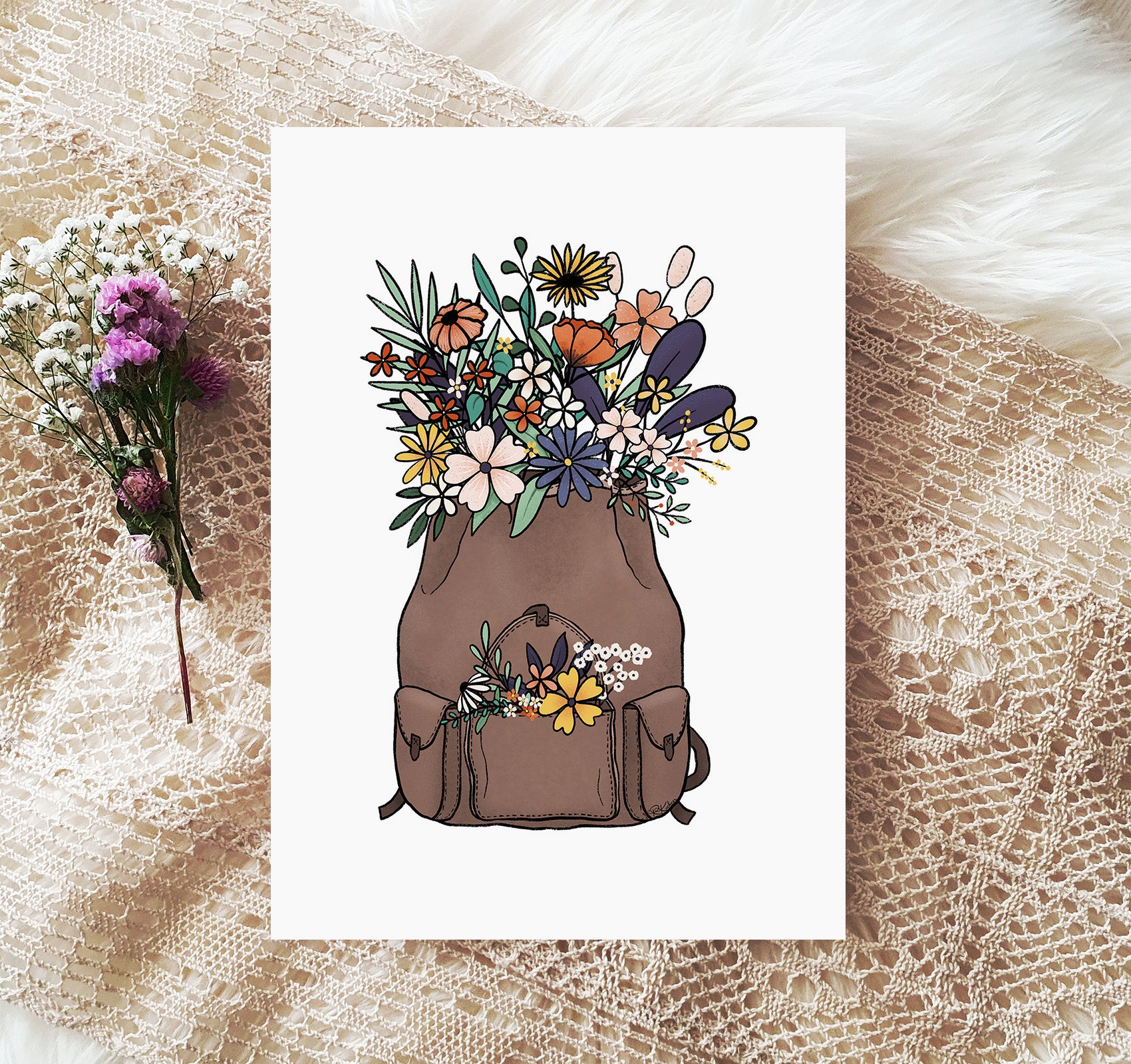 Brown leather backpack filled with wildflowers art print