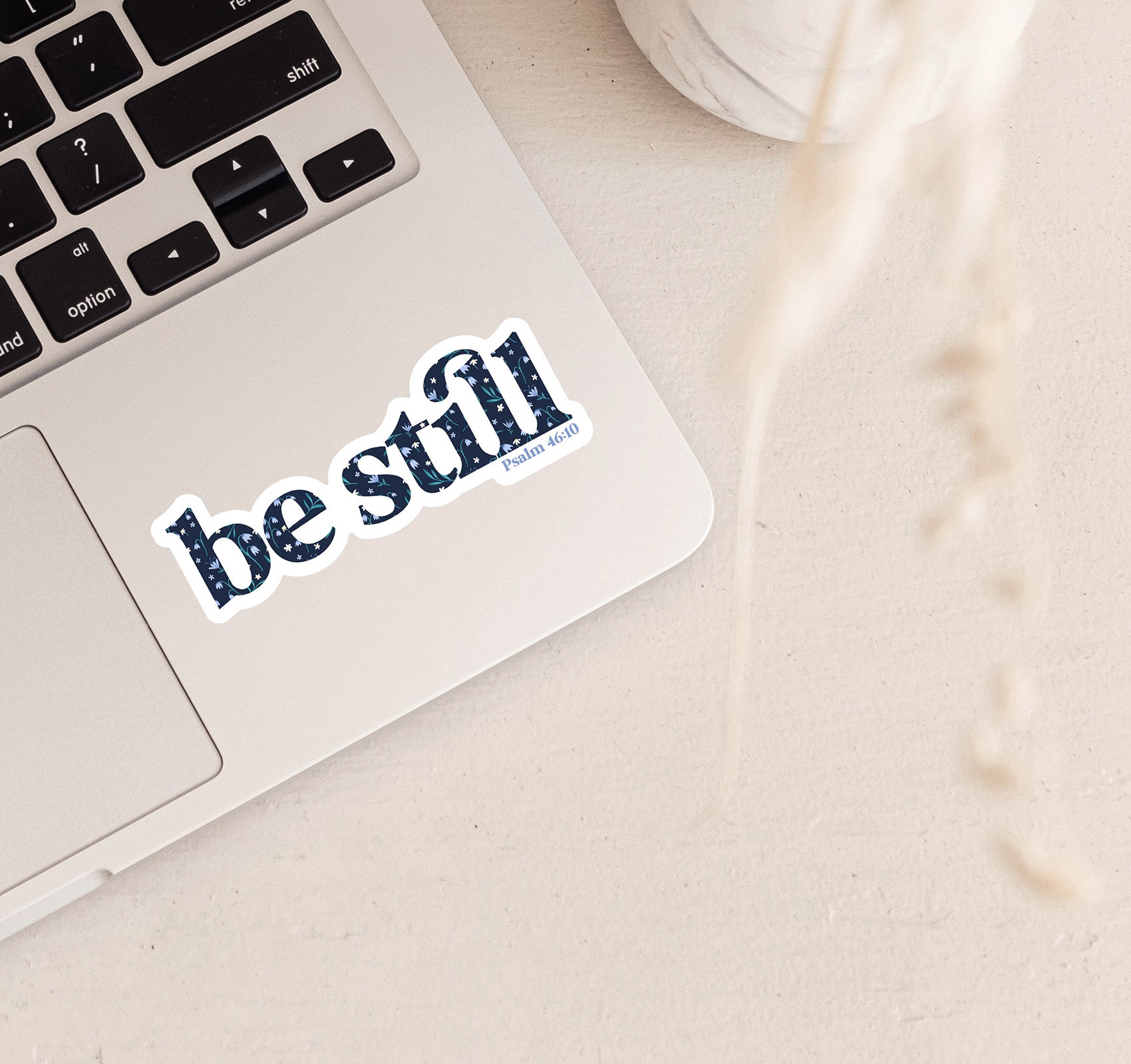 Be still, Psalm 46:10 Bible verse Christian laptop sticker with a floral pattern