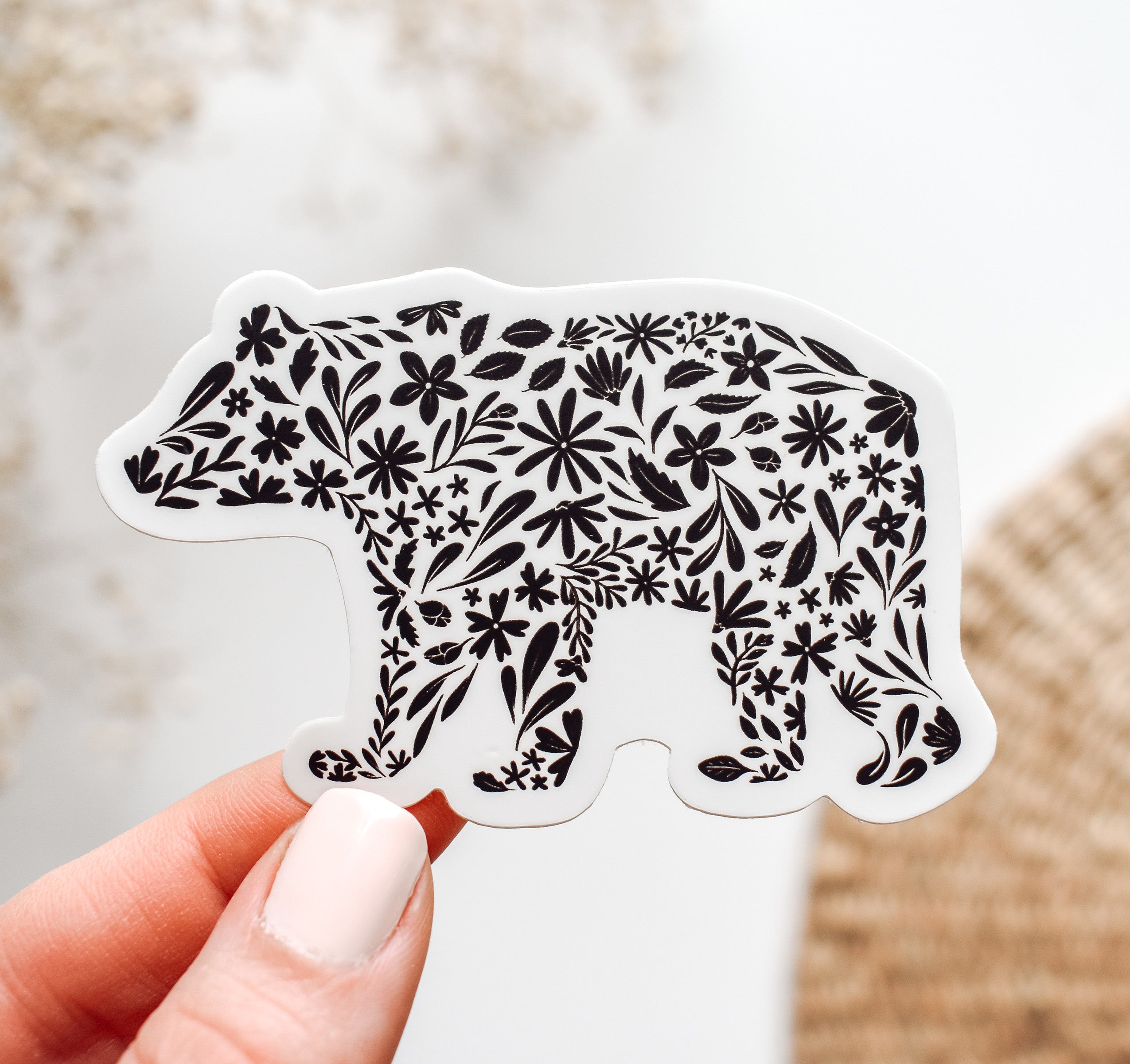 Decorative bear vinyl sticker with black floral patterns