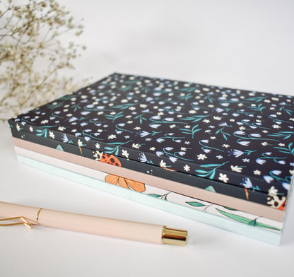 Stack of notebooks by Wild Peonies Studio