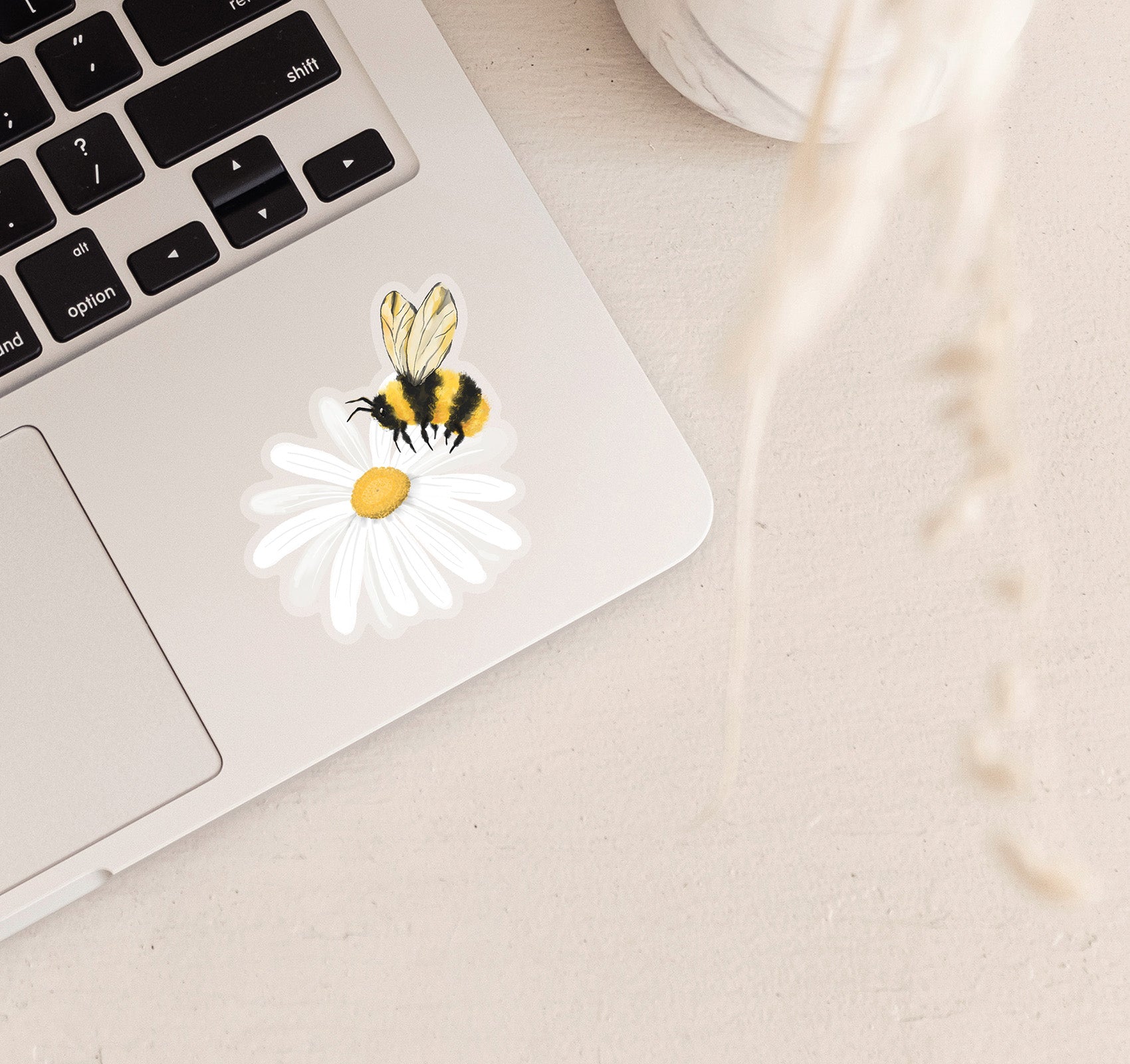 Bumble bee on a daisy flower laptop sticker