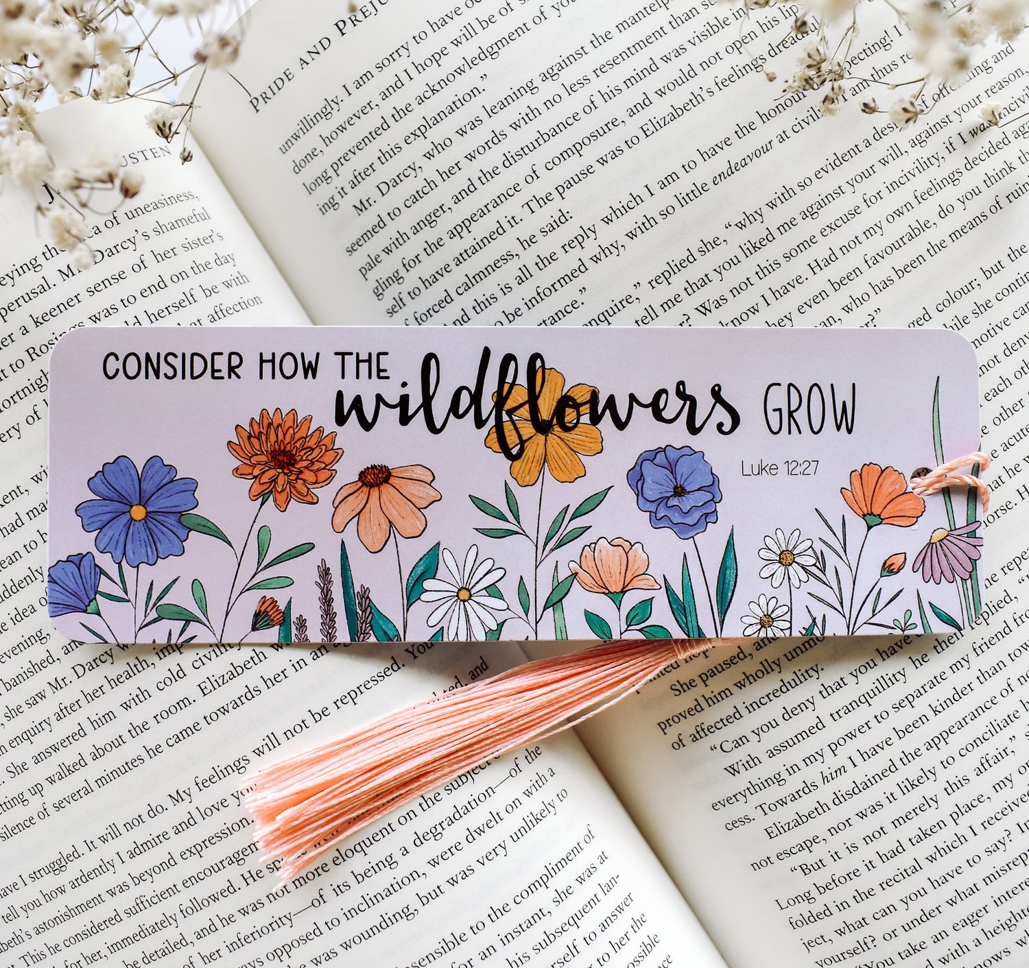 Christian Luke 12:27 Bible verse bookmark with flowers and a pink tassel