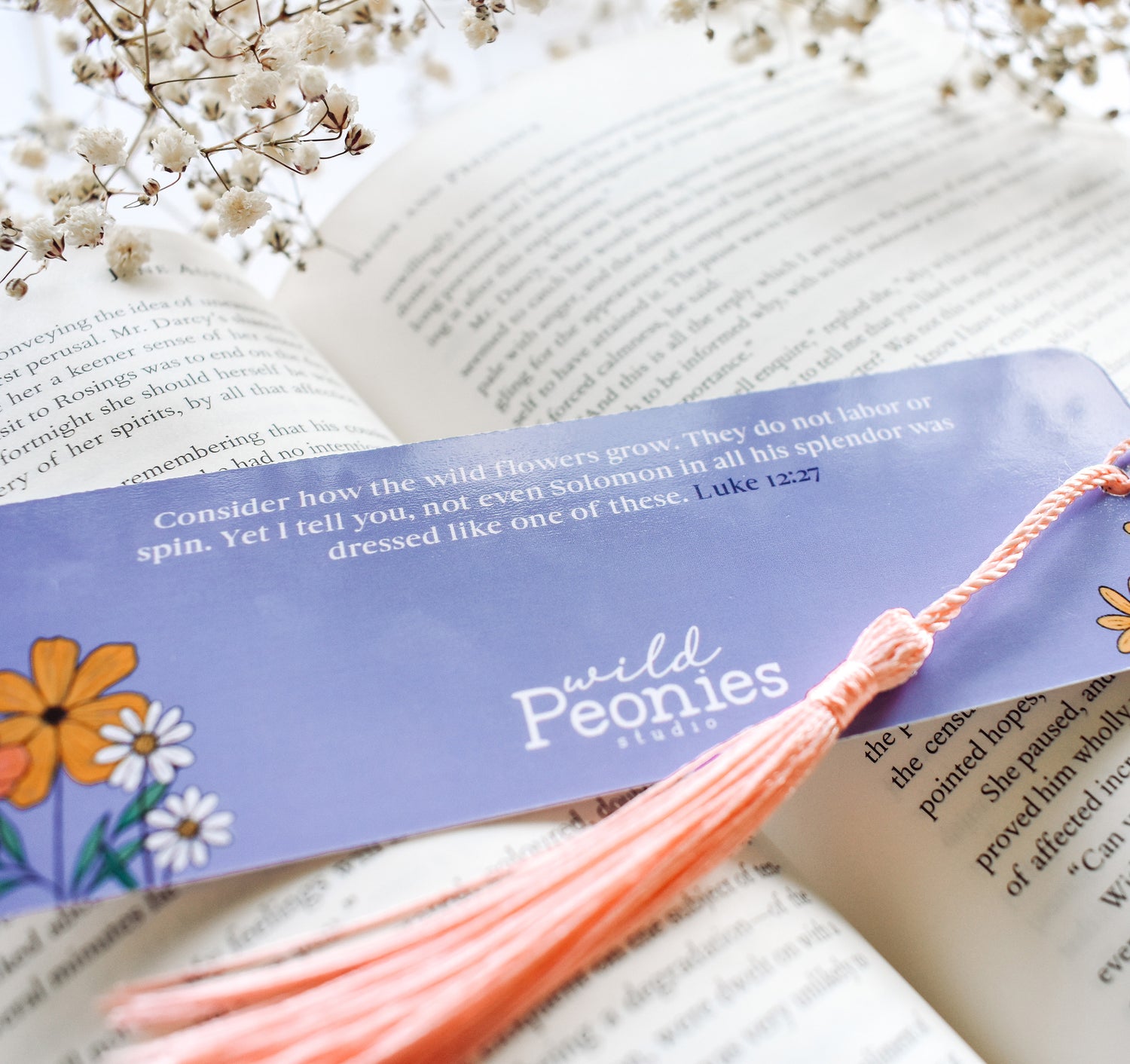 Christian Luke 12:27 Bible verse bookmark with flowers and a pink tassel