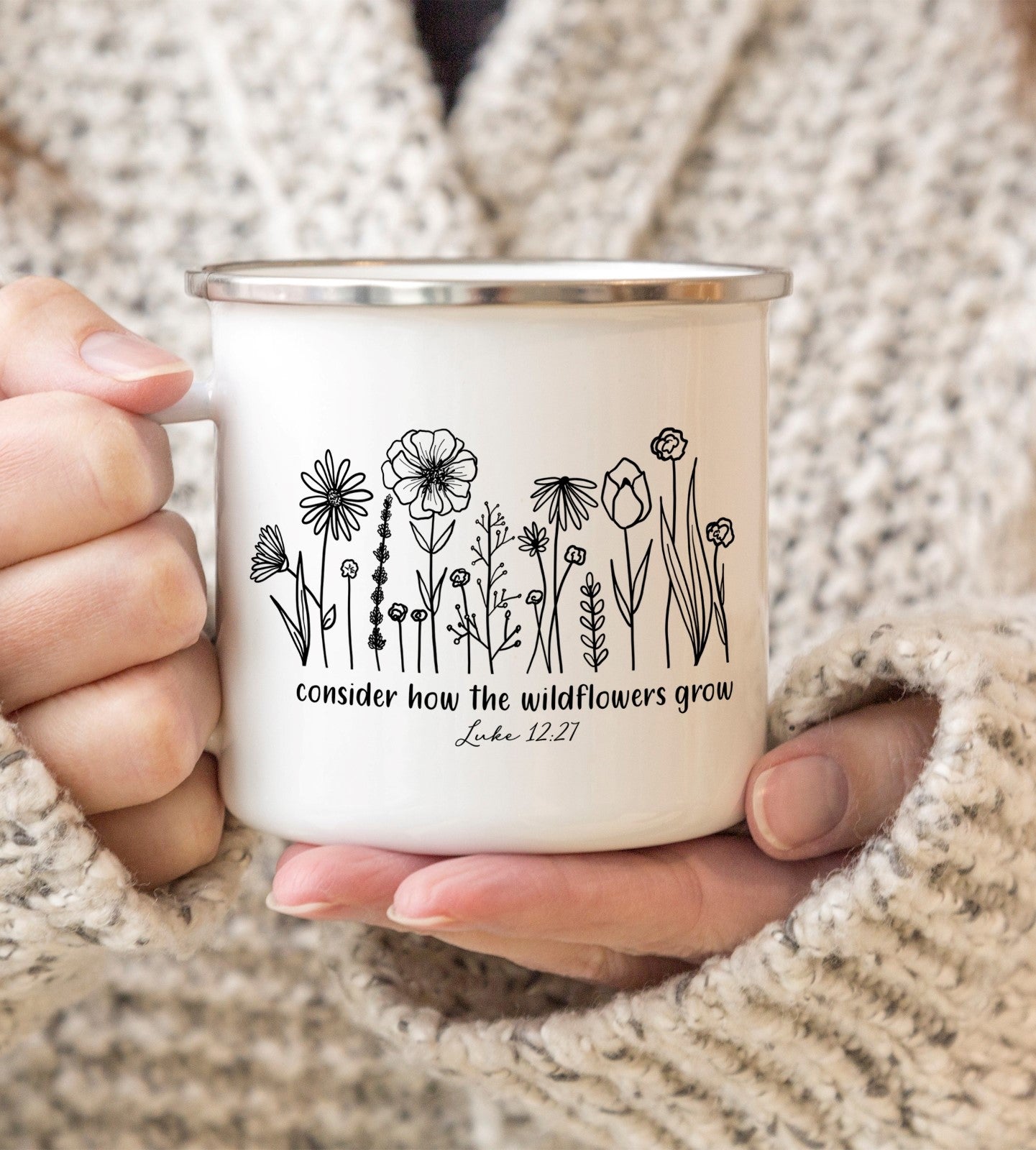 A Christian Bible verse enamel mug of Luke 12:27 Consider how the wildflowers grow, with a flower design