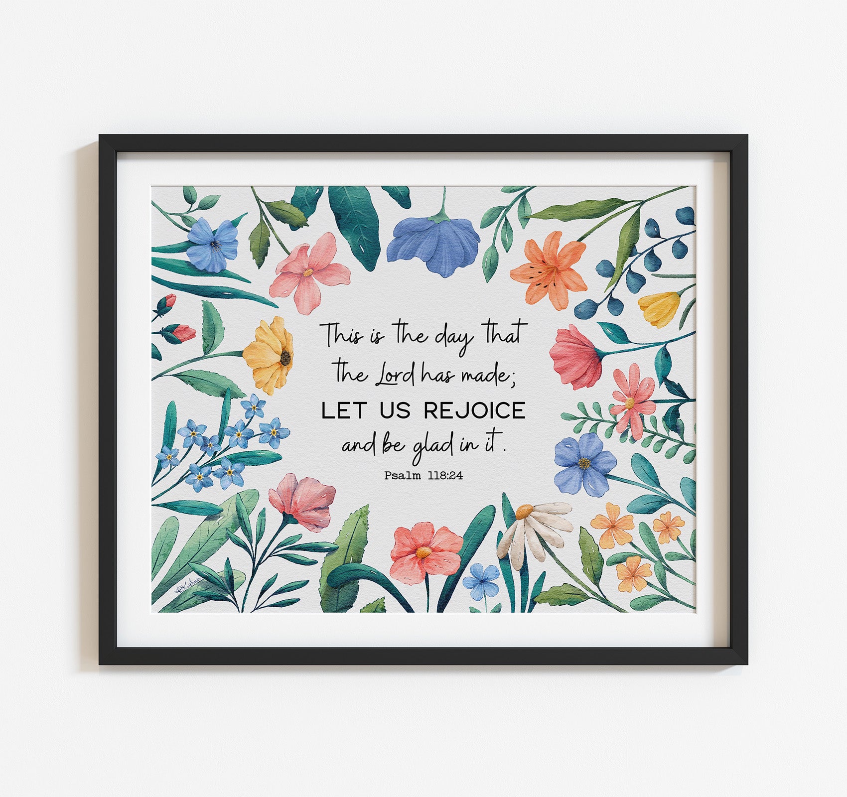 Art print with the Psalm 118:24 Bible verse This is the day that the Lord has made; let us rejoice and be glad in it. This scripture is surrounded by watercolor wildflowers.