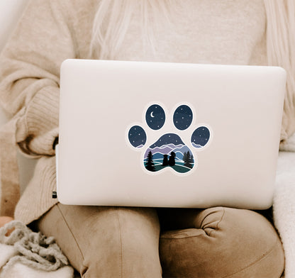 Dog paw print laptop sticker of a girl and dog watching the stars and moon