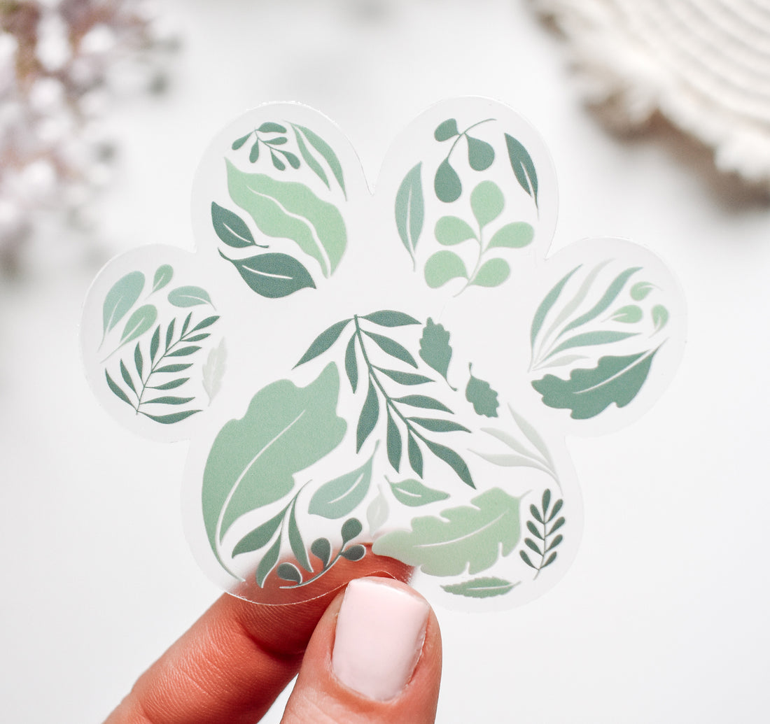 Leaves and nature sticker in the shape of a dog paw print