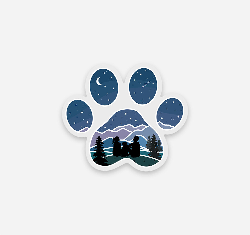 Dog paw print sticker with a couple and their dog looking at the stars