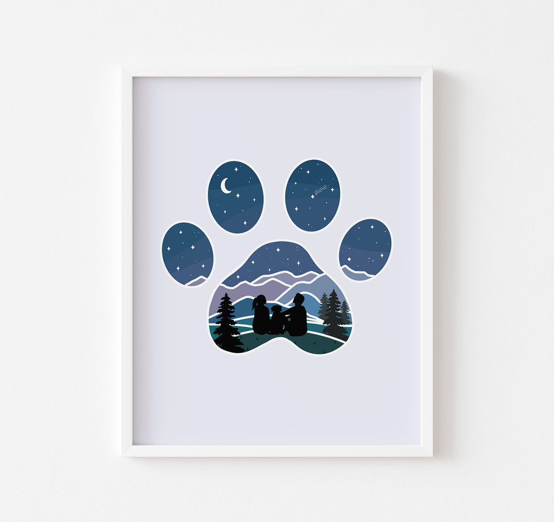 Art print of dog paw print with a couple and their dog watching the stars over the mountains