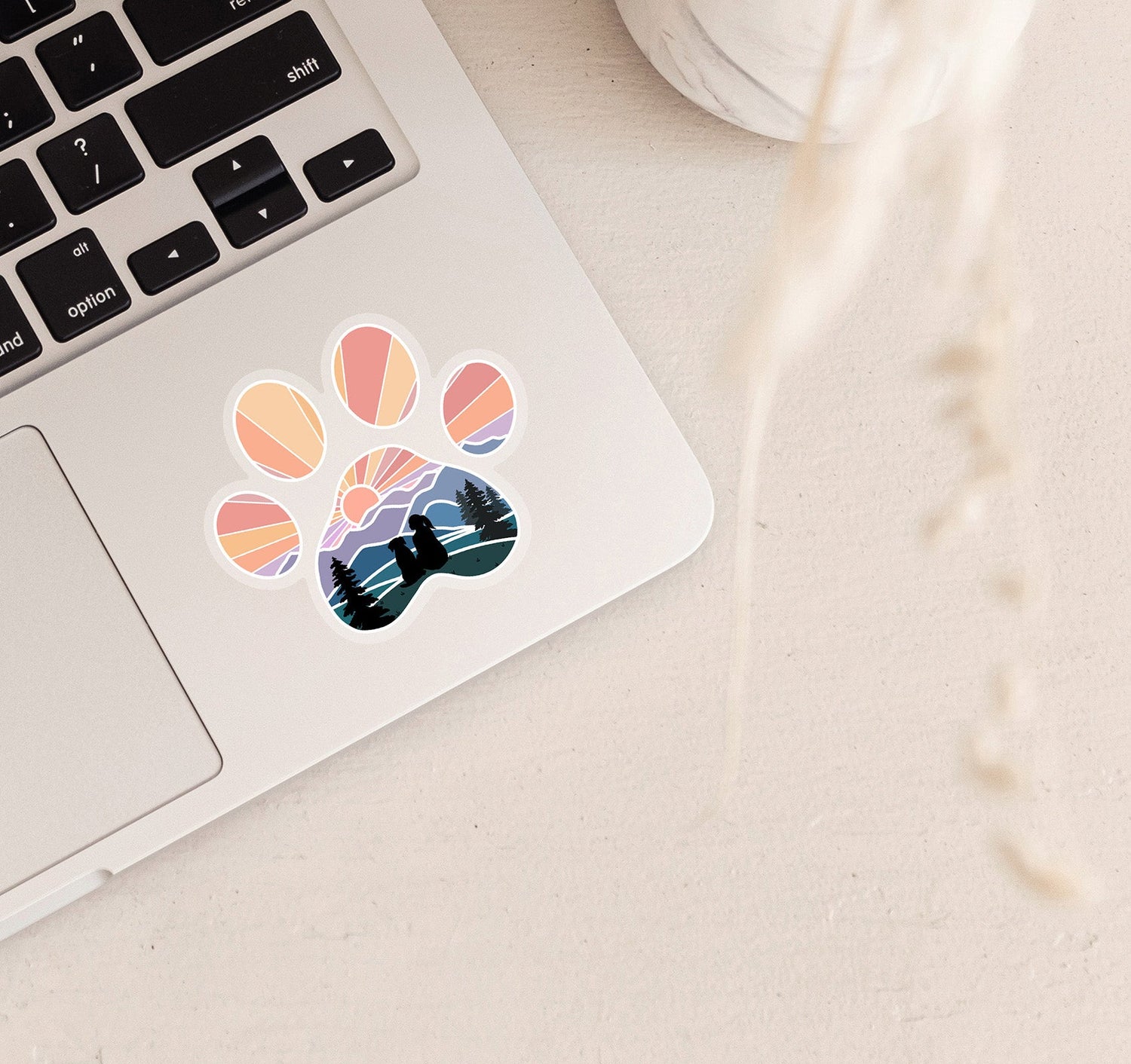 Dog paw print laptop decal of a girl and dog watching the sunset