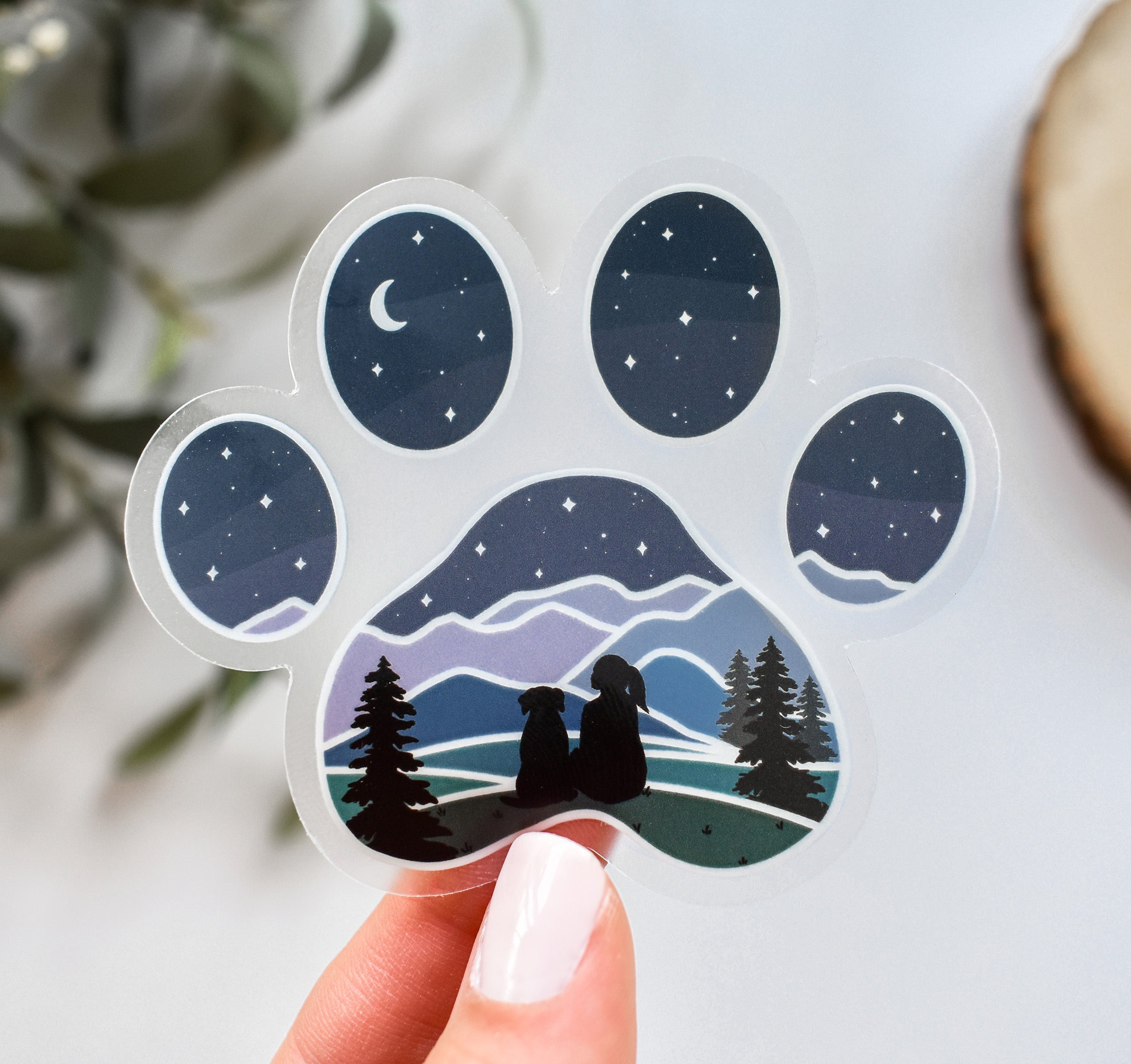 Dog paw print sticker of a girl and dog watching the stars and moon