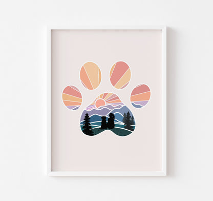 Art print of dog paw print with a girl and her dog watching the sunset over the mountains