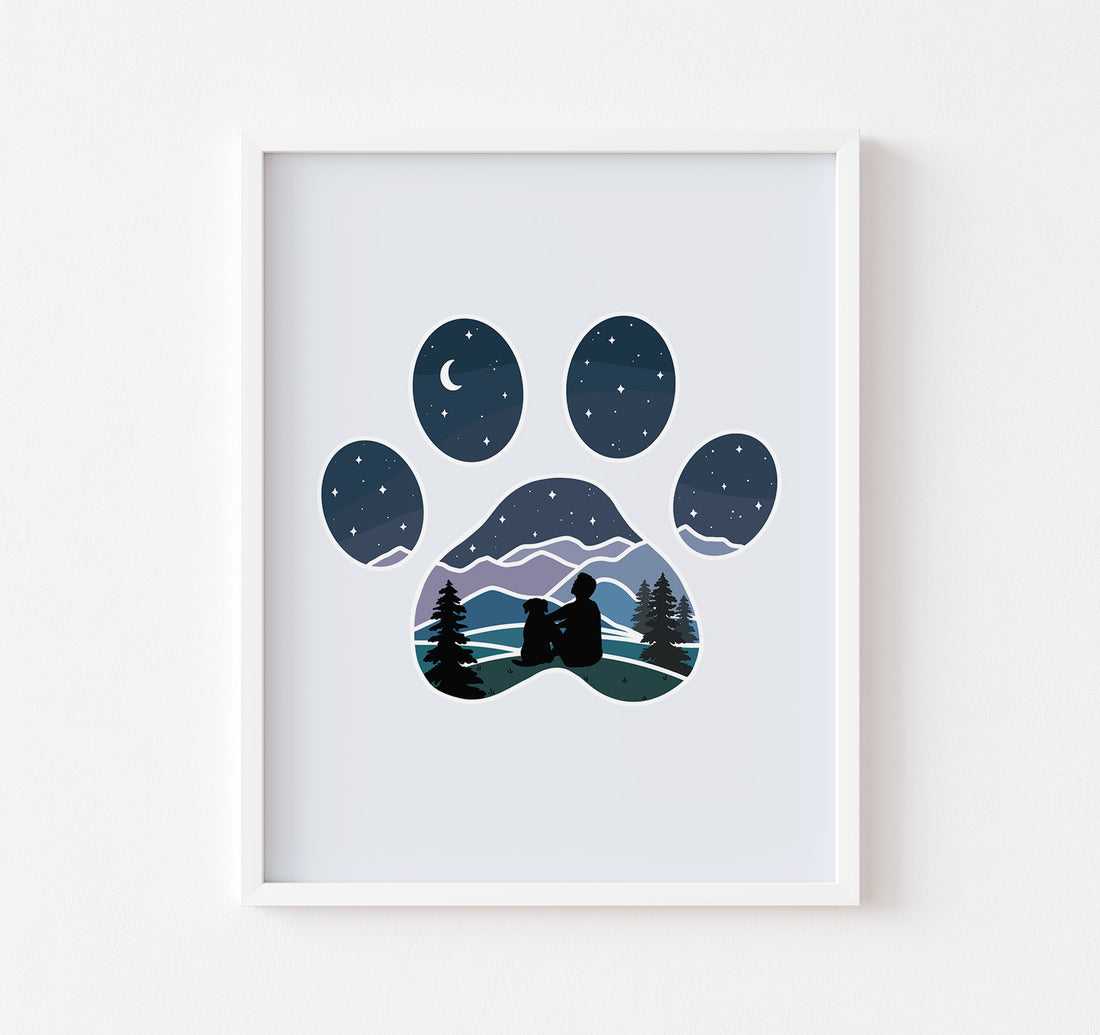 Art print of dog paw print with a man and his dog watching the stars over the mountains