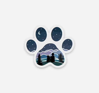 Dog paw print sticker with a guy and his dog looking at the stars and moon