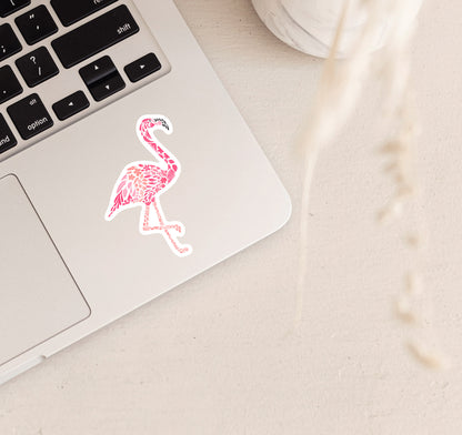 Pink flamingo sticker created from delicate flowers on a laptop