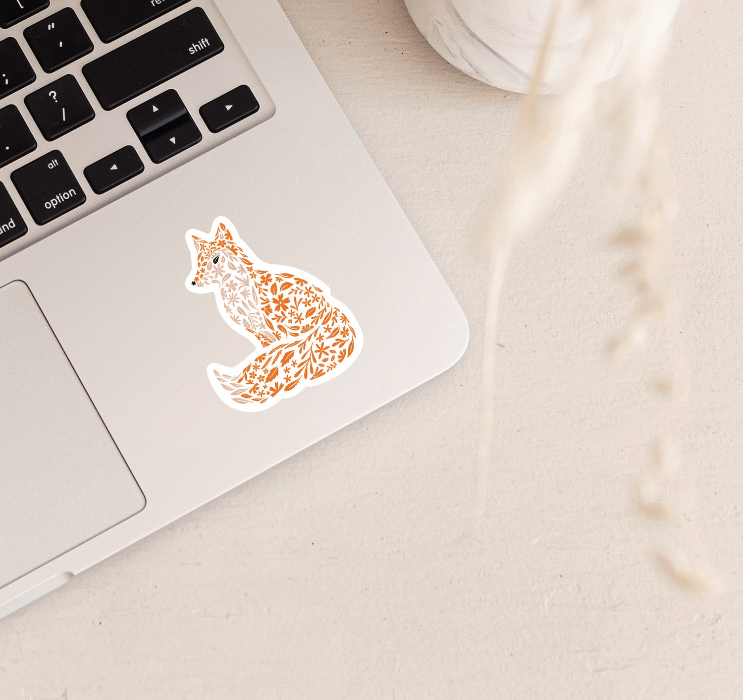 Decorative vinyl laptop sticker of a fox with floral patterns