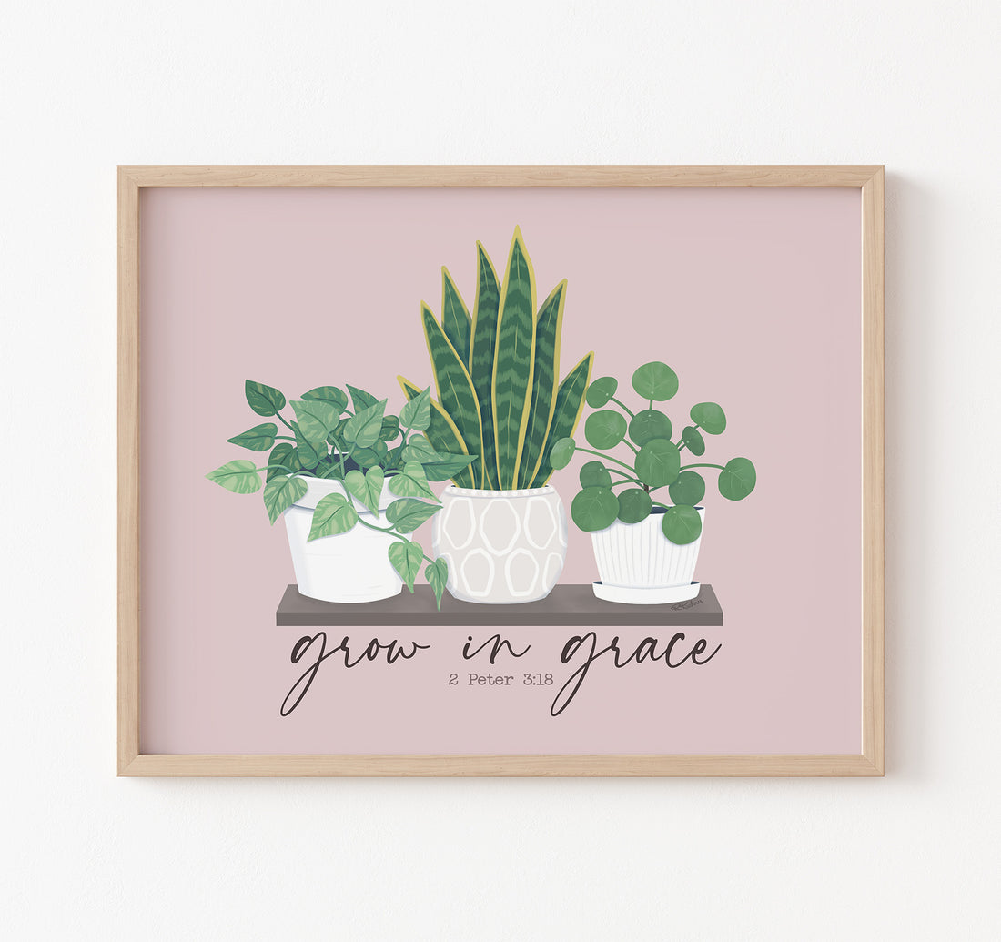 Christian plant art with a marble queen pothos plant, snake plant, and pilea peperomiodes
