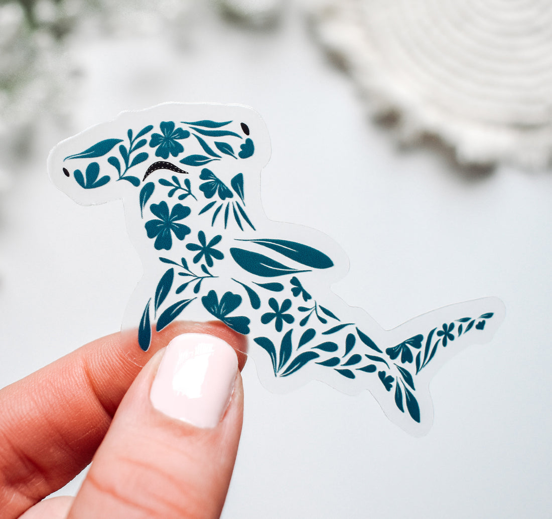 Hammerhead shark sticker created with turquoise flowers and leaves pattern