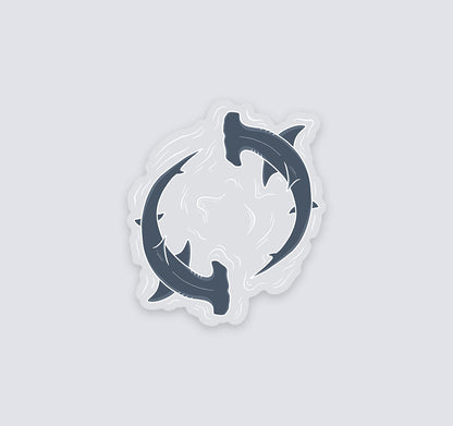 Clear vinyl sticker of two hammerhead sharks circling through water