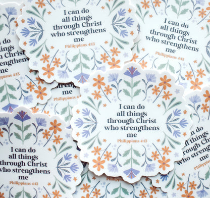 A pile of Christian faith stickers with the Bible verse "I can do all things through Christ who strengthens me, Philippians 4:13" surrounded by hand-drawn purple and orange flowers.
