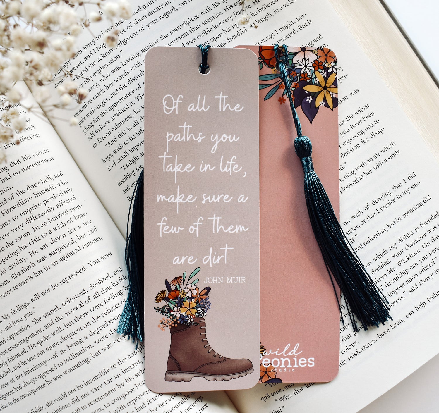 Bookmark with the John Muir quote &quot;Of all the paths you take in life, make sure a few of them are dirt&quot; and a hiking boot with flowers design