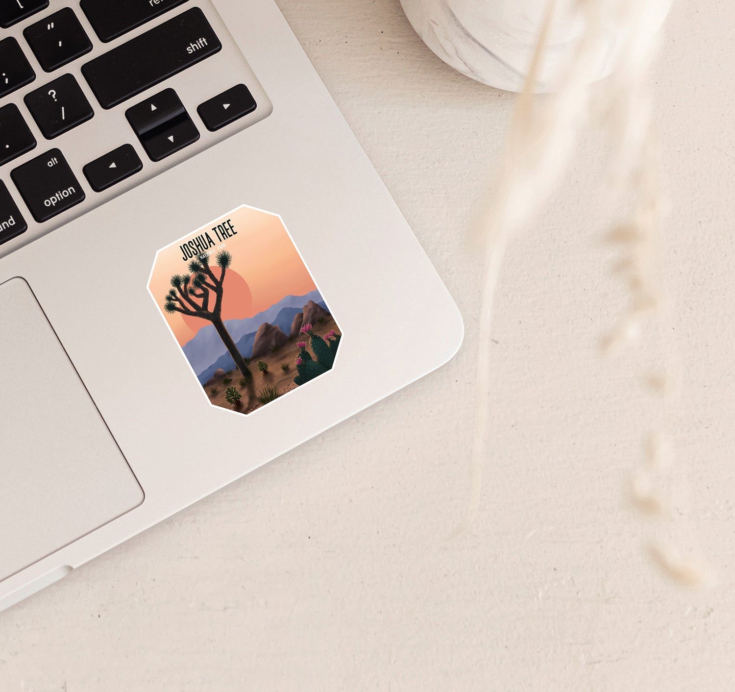 Joshua Tree National Park laptop sticker with yucca tree, cactus, and mountains