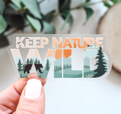 Keep Nature Wild sticker of a bear by the forest and mountains at sunset