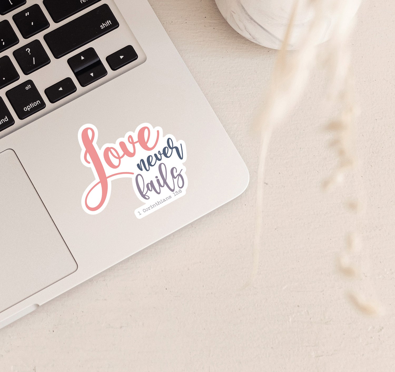 Love never fails, 1 Corinthians 13:8 Bible verse Christian laptop sticker