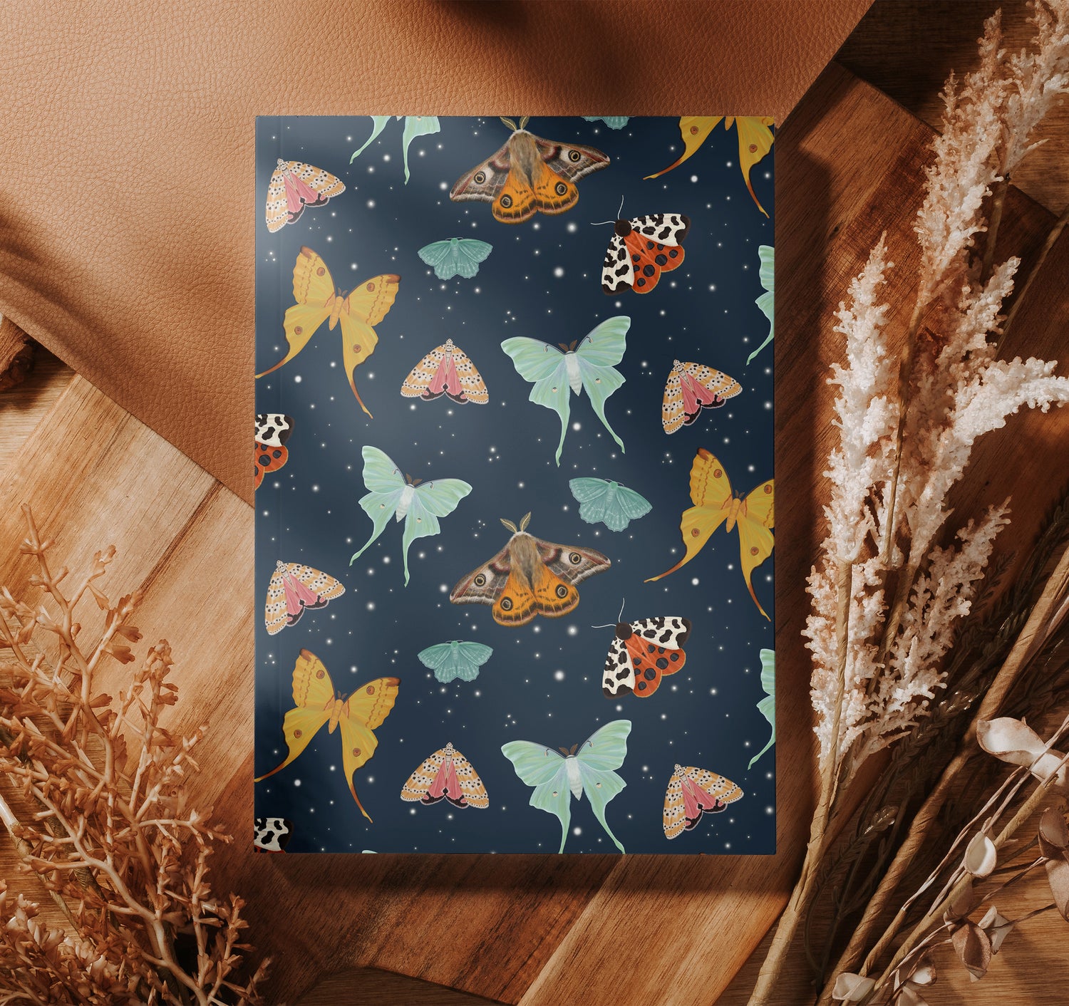 Journal with a design of moths on the front and back cover